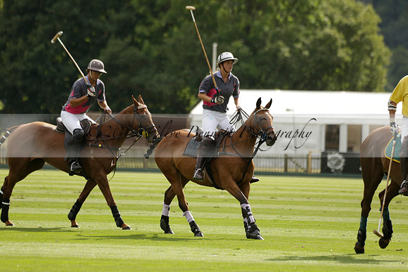 La Tremenda (lilac) v Maiz Dulce (yellow) in a Brecknock Cup polo match played on Lawns 1 at the Cowdray Park Polo Club on Tuesday 13 August 2013