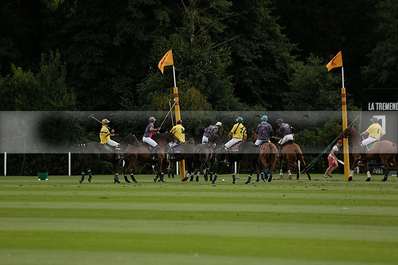 La Tremenda (lilac) v Maiz Dulce (yellow) in a Brecknock Cup polo match played on Lawns 1 at the Cowdray Park Polo Club on Tuesday 13 August 2013