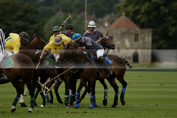 La Tremenda (lilac) v Maiz Dulce (yellow) in a Brecknock Cup polo match played on Lawns 1 at the Cowdray Park Polo Club on Tuesday 13 August 2013