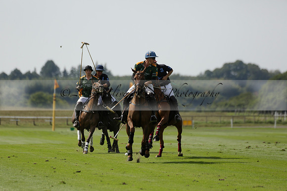 Maiz Dulce (green) v River (blue) in a Uber Polo Midsummer 12 goal polo match on Wednesday 21 August 2013 at Cowdray park Polo Club on Ambersham 2.  www.polopictures.co.uk