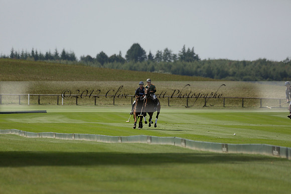 Maiz Dulce (green) v River (blue) in a Uber Polo Midsummer 12 goal polo match on Wednesday 21 August 2013 at Cowdray park Polo Club on Ambersham 2.  www.polopictures.co.uk