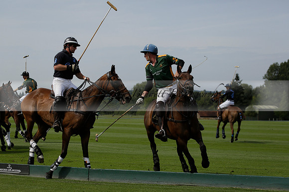 Maiz Dulce (green) v River (blue) in a Uber Polo Midsummer 12 goal polo match on Wednesday 21 August 2013 at Cowdray park Polo Club on Ambersham 2.  www.polopictures.co.uk