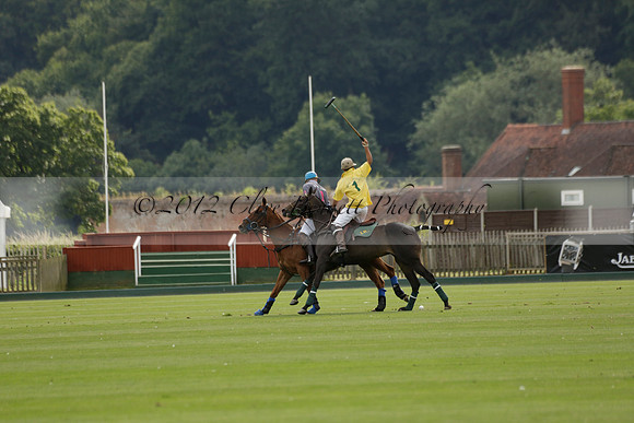 La Tremenda (lilac) v Maiz Dulce (yellow) in a Brecknock Cup polo match played on Lawns 1 at the Cowdray Park Polo Club on Tuesday 13 August 2013