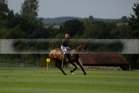 Maiz Dulce (green) v River (blue) in a Uber Polo Midsummer 12 goal polo match on Wednesday 21 August 2013 at Cowdray park Polo Club on Ambersham 2.  www.polopictures.co.uk