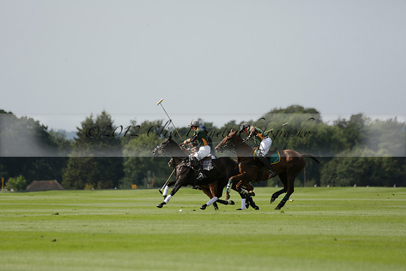 Maiz Dulce (green) v River (blue) in a Uber Polo Midsummer 12 goal polo match on Wednesday 21 August 2013 at Cowdray park Polo Club on Ambersham 2.  www.polopictures.co.uk