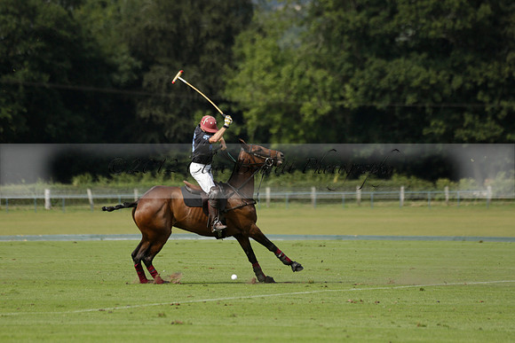 Maiz Dulce (green) v River (blue) in a Uber Polo Midsummer 12 goal polo match on Wednesday 21 August 2013 at Cowdray park Polo Club on Ambersham 2.  www.polopictures.co.uk
