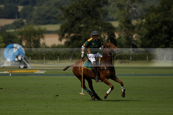 Maiz Dulce (green) v River (blue) in a Uber Polo Midsummer 12 goal polo match on Wednesday 21 August 2013 at Cowdray park Polo Club on Ambersham 2.  www.polopictures.co.uk