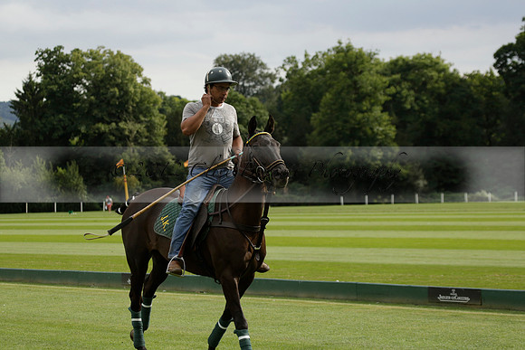 La Tremenda (lilac) v Maiz Dulce (yellow) in a Brecknock Cup polo match played on Lawns 1 at the Cowdray Park Polo Club on Tuesday 13 August 2013