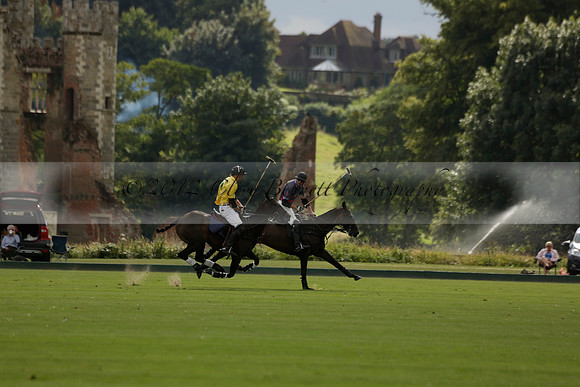 La Tremenda (lilac) v Maiz Dulce (yellow) in a Brecknock Cup polo match played on Lawns 1 at the Cowdray Park Polo Club on Tuesday 13 August 2013