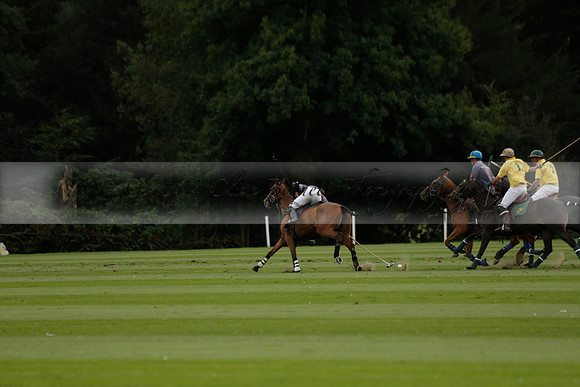 La Tremenda (lilac) v Maiz Dulce (yellow) in a Brecknock Cup polo match played on Lawns 1 at the Cowdray Park Polo Club on Tuesday 13 August 2013