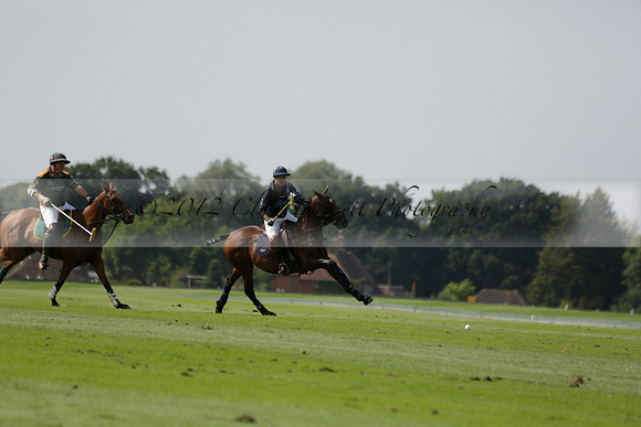 Maiz Dulce (green) v River (blue) in a Uber Polo Midsummer 12 goal polo match on Wednesday 21 August 2013 at Cowdray park Polo Club on Ambersham 2.  www.polopictures.co.uk