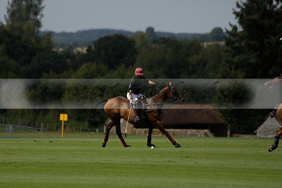 Maiz Dulce (green) v River (blue) in a Uber Polo Midsummer 12 goal polo match on Wednesday 21 August 2013 at Cowdray park Polo Club on Ambersham 2.  www.polopictures.co.uk