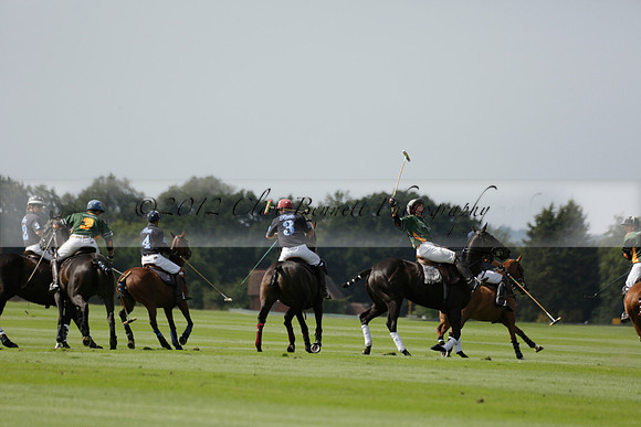 Maiz Dulce (green) v River (blue) in a Uber Polo Midsummer 12 goal polo match on Wednesday 21 August 2013 at Cowdray park Polo Club on Ambersham 2.  www.polopictures.co.uk