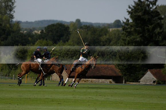 Maiz Dulce (green) v River (blue) in a Uber Polo Midsummer 12 goal polo match on Wednesday 21 August 2013 at Cowdray park Polo Club on Ambersham 2.  www.polopictures.co.uk