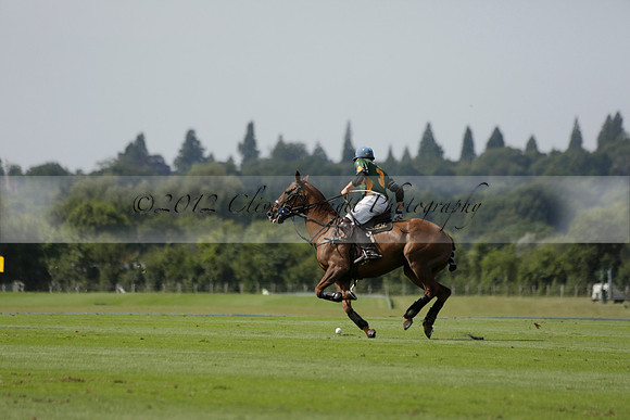Maiz Dulce (green) v River (blue) in a Uber Polo Midsummer 12 goal polo match on Wednesday 21 August 2013 at Cowdray park Polo Club on Ambersham 2.  www.polopictures.co.uk