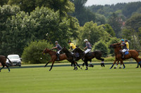 La Tremenda (lilac) v Maiz Dulce (yellow) in a Brecknock Cup polo match played on Lawns 1 at the Cowdray Park Polo Club on Tuesday 13 August 2013