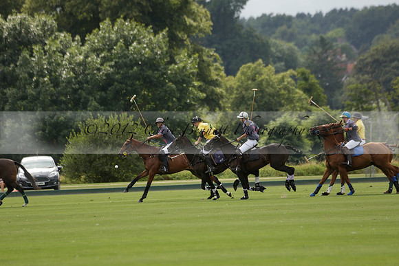 La Tremenda (lilac) v Maiz Dulce (yellow) in a Brecknock Cup polo match played on Lawns 1 at the Cowdray Park Polo Club on Tuesday 13 August 2013