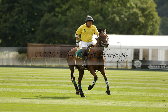 La Tremenda (lilac) v Maiz Dulce (yellow) in a Brecknock Cup polo match played on Lawns 1 at the Cowdray Park Polo Club on Tuesday 13 August 2013