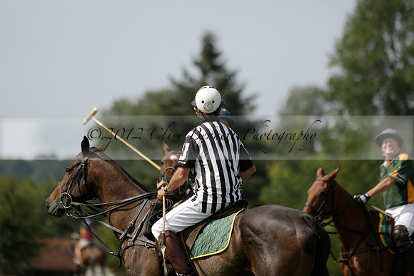 Maiz Dulce (green) v River (blue) in a Uber Polo Midsummer 12 goal polo match on Wednesday 21 August 2013 at Cowdray park Polo Club on Ambersham 2.  www.polopictures.co.uk