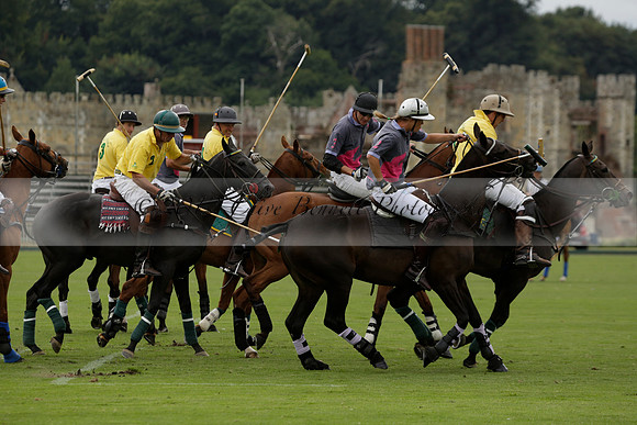 La Tremenda (lilac) v Maiz Dulce (yellow) in a Brecknock Cup polo match played on Lawns 1 at the Cowdray Park Polo Club on Tuesday 13 August 2013