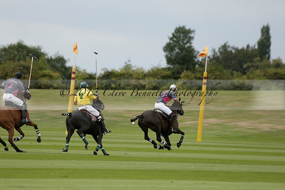 La Tremenda (lilac) v Maiz Dulce (yellow) in a Brecknock Cup polo match played on Lawns 1 at the Cowdray Park Polo Club on Tuesday 13 August 2013