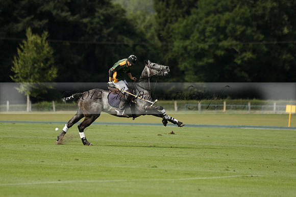 Maiz Dulce (green) v River (blue) in a Uber Polo Midsummer 12 goal polo match on Wednesday 21 August 2013 at Cowdray park Polo Club on Ambersham 2.  www.polopictures.co.uk