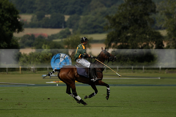 Maiz Dulce (green) v River (blue) in a Uber Polo Midsummer 12 goal polo match on Wednesday 21 August 2013 at Cowdray park Polo Club on Ambersham 2.  www.polopictures.co.uk