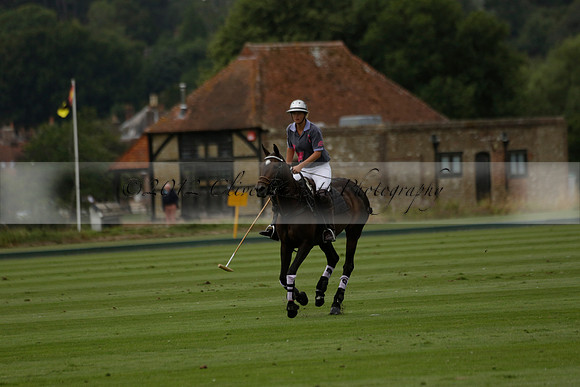 La Tremenda (lilac) v Maiz Dulce (yellow) in a Brecknock Cup polo match played on Lawns 1 at the Cowdray Park Polo Club on Tuesday 13 August 2013