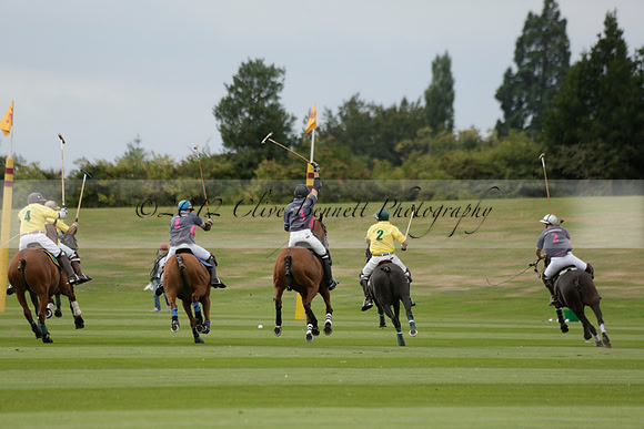La Tremenda (lilac) v Maiz Dulce (yellow) in a Brecknock Cup polo match played on Lawns 1 at the Cowdray Park Polo Club on Tuesday 13 August 2013