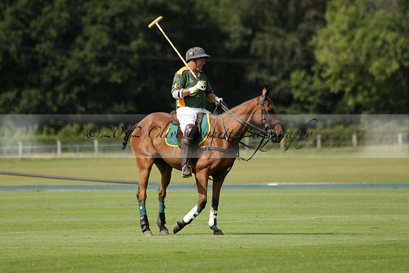 Maiz Dulce (green) v River (blue) in a Uber Polo Midsummer 12 goal polo match on Wednesday 21 August 2013 at Cowdray park Polo Club on Ambersham 2.  www.polopictures.co.uk