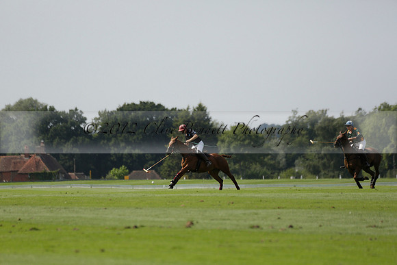 Maiz Dulce (green) v River (blue) in a Uber Polo Midsummer 12 goal polo match on Wednesday 21 August 2013 at Cowdray park Polo Club on Ambersham 2.  www.polopictures.co.uk