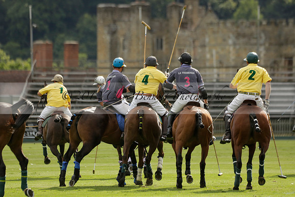 La Tremenda (lilac) v Maiz Dulce (yellow) in a Brecknock Cup polo match played on Lawns 1 at the Cowdray Park Polo Club on Tuesday 13 August 2013