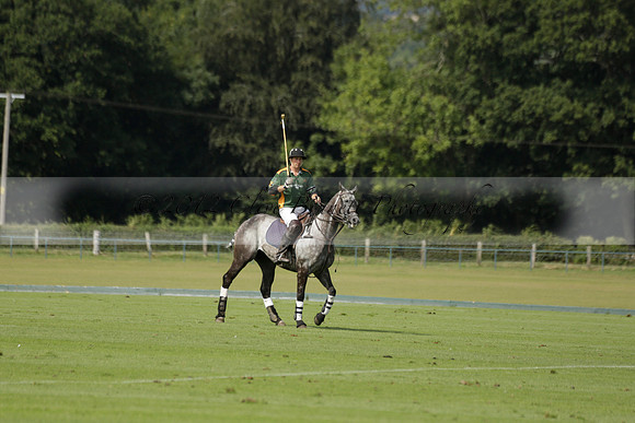 Maiz Dulce (green) v River (blue) in a Uber Polo Midsummer 12 goal polo match on Wednesday 21 August 2013 at Cowdray park Polo Club on Ambersham 2.  www.polopictures.co.uk