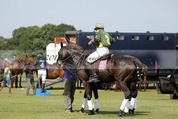 Maiz Dulce (green) v River (blue) in a Uber Polo Midsummer 12 goal polo match on Wednesday 21 August 2013 at Cowdray park Polo Club on Ambersham 2.  www.polopictures.co.uk