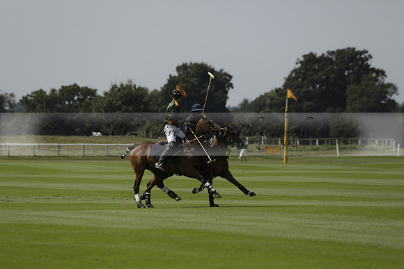 Maiz Dulce (green) v River (blue) in a Uber Polo Midsummer 12 goal polo match on Wednesday 21 August 2013 at Cowdray park Polo Club on Ambersham 2.  www.polopictures.co.uk