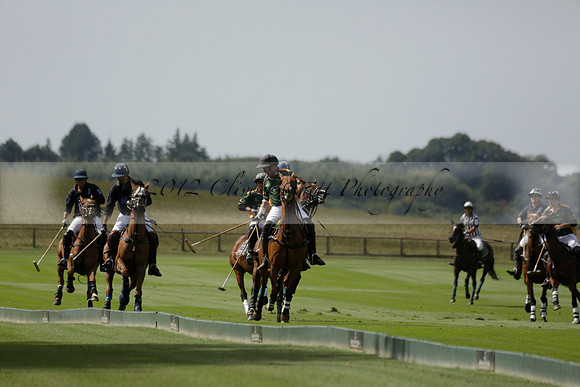 Maiz Dulce (green) v River (blue) in a Uber Polo Midsummer 12 goal polo match on Wednesday 21 August 2013 at Cowdray park Polo Club on Ambersham 2.  www.polopictures.co.uk