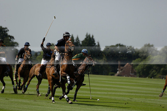Maiz Dulce (green) v River (blue) in a Uber Polo Midsummer 12 goal polo match on Wednesday 21 August 2013 at Cowdray park Polo Club on Ambersham 2.  www.polopictures.co.uk
