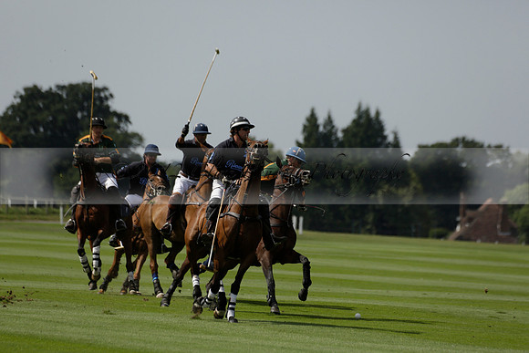 Maiz Dulce (green) v River (blue) in a Uber Polo Midsummer 12 goal polo match on Wednesday 21 August 2013 at Cowdray park Polo Club on Ambersham 2.  www.polopictures.co.uk