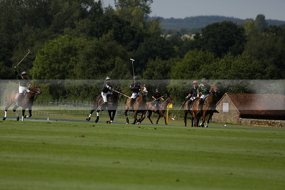 Maiz Dulce (green) v River (blue) in a Uber Polo Midsummer 12 goal polo match on Wednesday 21 August 2013 at Cowdray park Polo Club on Ambersham 2.  www.polopictures.co.uk
