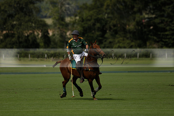 Maiz Dulce (green) v River (blue) in a Uber Polo Midsummer 12 goal polo match on Wednesday 21 August 2013 at Cowdray park Polo Club on Ambersham 2.  www.polopictures.co.uk