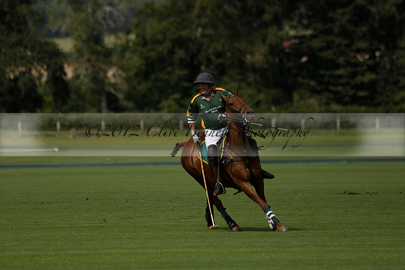 Maiz Dulce (green) v River (blue) in a Uber Polo Midsummer 12 goal polo match on Wednesday 21 August 2013 at Cowdray park Polo Club on Ambersham 2.  www.polopictures.co.uk