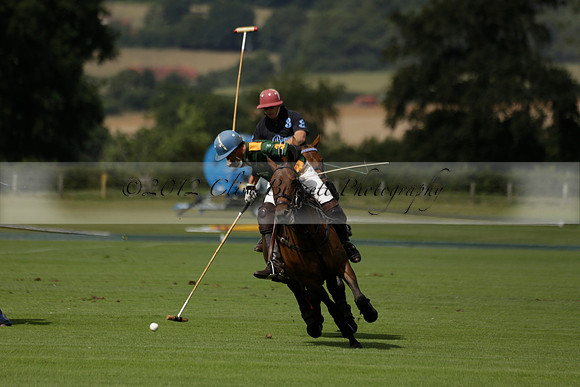 Maiz Dulce (green) v River (blue) in a Uber Polo Midsummer 12 goal polo match on Wednesday 21 August 2013 at Cowdray park Polo Club on Ambersham 2.  www.polopictures.co.uk