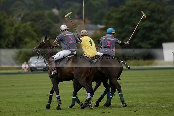 La Tremenda (lilac) v Maiz Dulce (yellow) in a Brecknock Cup polo match played on Lawns 1 at the Cowdray Park Polo Club on Tuesday 13 August 2013