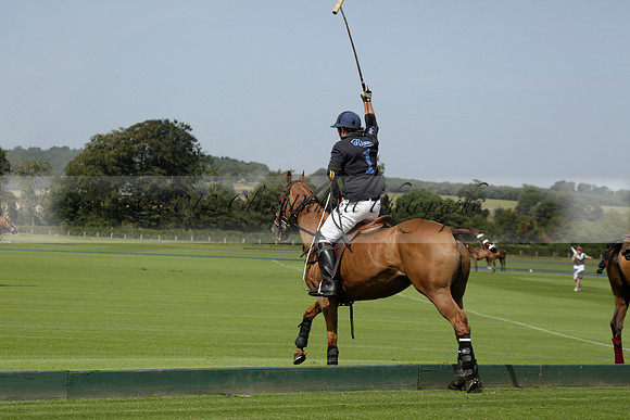 Maiz Dulce (green) v River (blue) in a Uber Polo Midsummer 12 goal polo match on Wednesday 21 August 2013 at Cowdray park Polo Club on Ambersham 2.  www.polopictures.co.uk