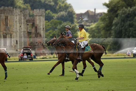 La Tremenda (lilac) v Maiz Dulce (yellow) in a Brecknock Cup polo match played on Lawns 1 at the Cowdray Park Polo Club on Tuesday 13 August 2013