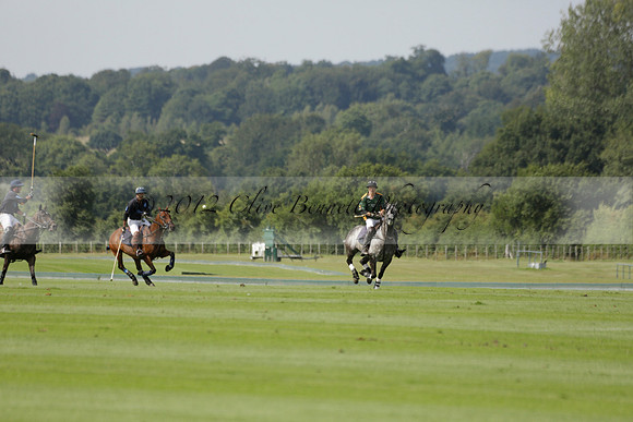 Maiz Dulce (green) v River (blue) in a Uber Polo Midsummer 12 goal polo match on Wednesday 21 August 2013 at Cowdray park Polo Club on Ambersham 2.  www.polopictures.co.uk