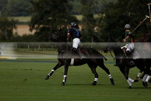 Maiz Dulce (green) v River (blue) in a Uber Polo Midsummer 12 goal polo match on Wednesday 21 August 2013 at Cowdray park Polo Club on Ambersham 2.  www.polopictures.co.uk