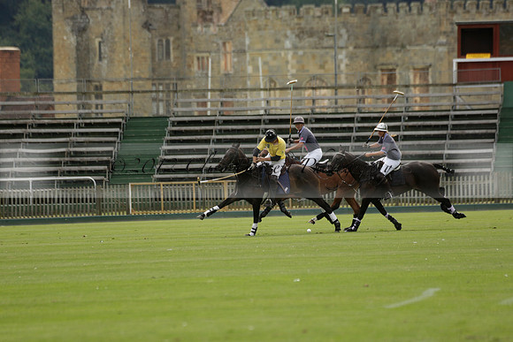 La Tremenda (lilac) v Maiz Dulce (yellow) in a Brecknock Cup polo match played on Lawns 1 at the Cowdray Park Polo Club on Tuesday 13 August 2013