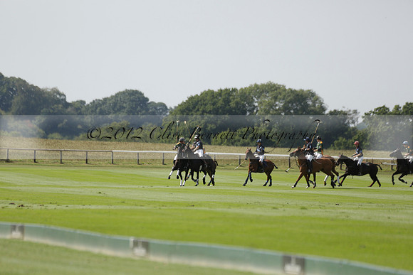 Maiz Dulce (green) v River (blue) in a Uber Polo Midsummer 12 goal polo match on Wednesday 21 August 2013 at Cowdray park Polo Club on Ambersham 2.  www.polopictures.co.uk