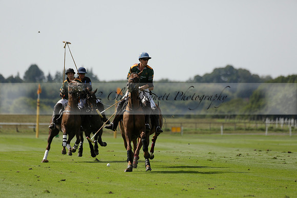 Maiz Dulce (green) v River (blue) in a Uber Polo Midsummer 12 goal polo match on Wednesday 21 August 2013 at Cowdray park Polo Club on Ambersham 2.  www.polopictures.co.uk